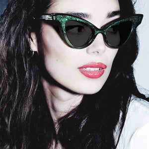 Model wearing green glimmer sunglassses by JOIUSS™