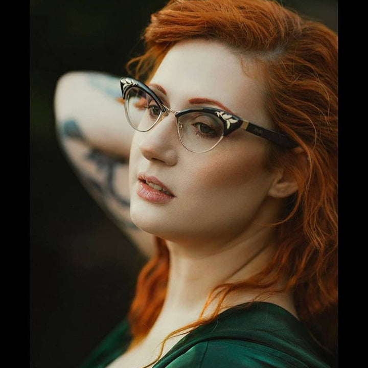 A beautiful red haired women wearing Rita glasses by JOIUSS