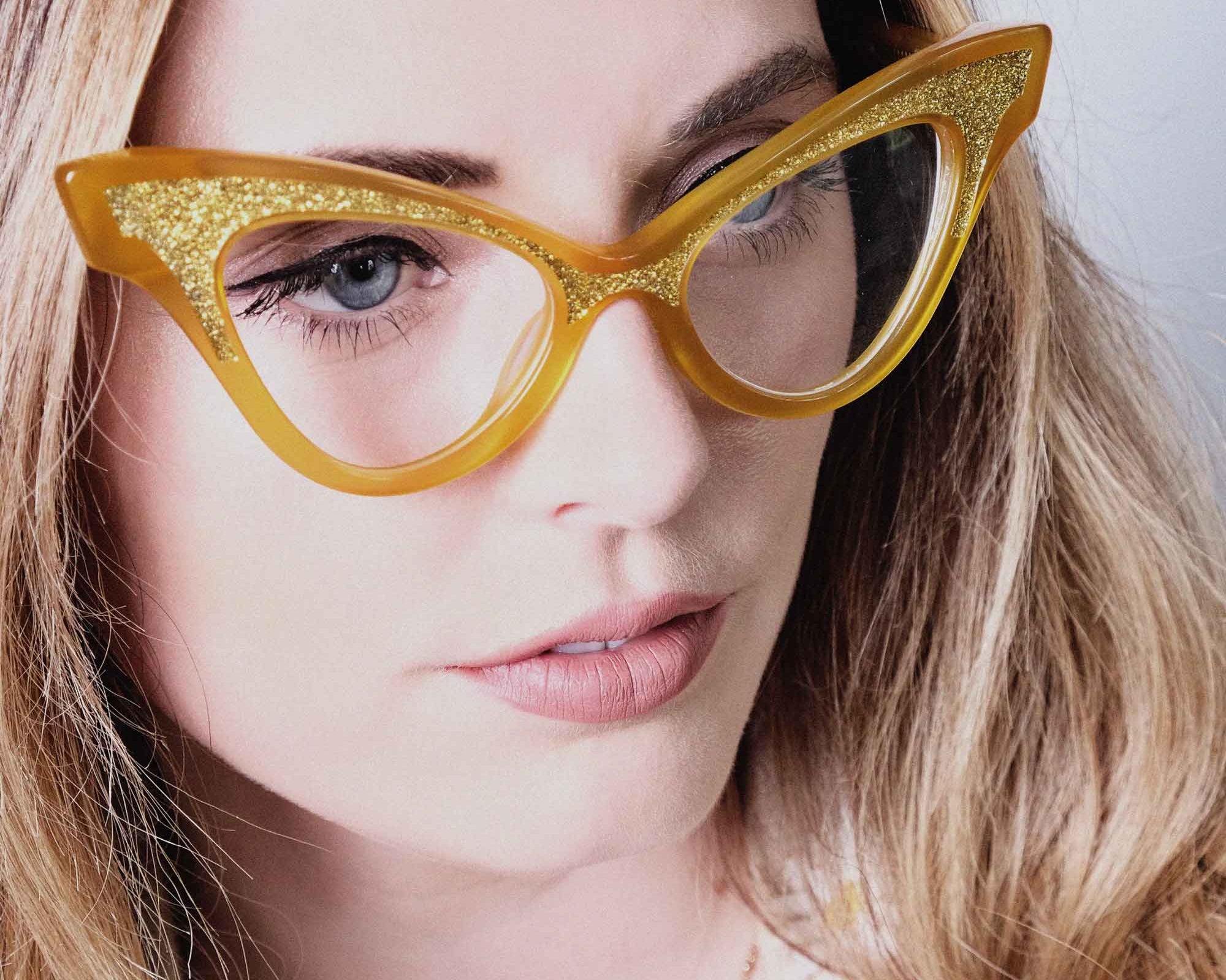 Lady wearing bold yellow and gold cat eye glasses