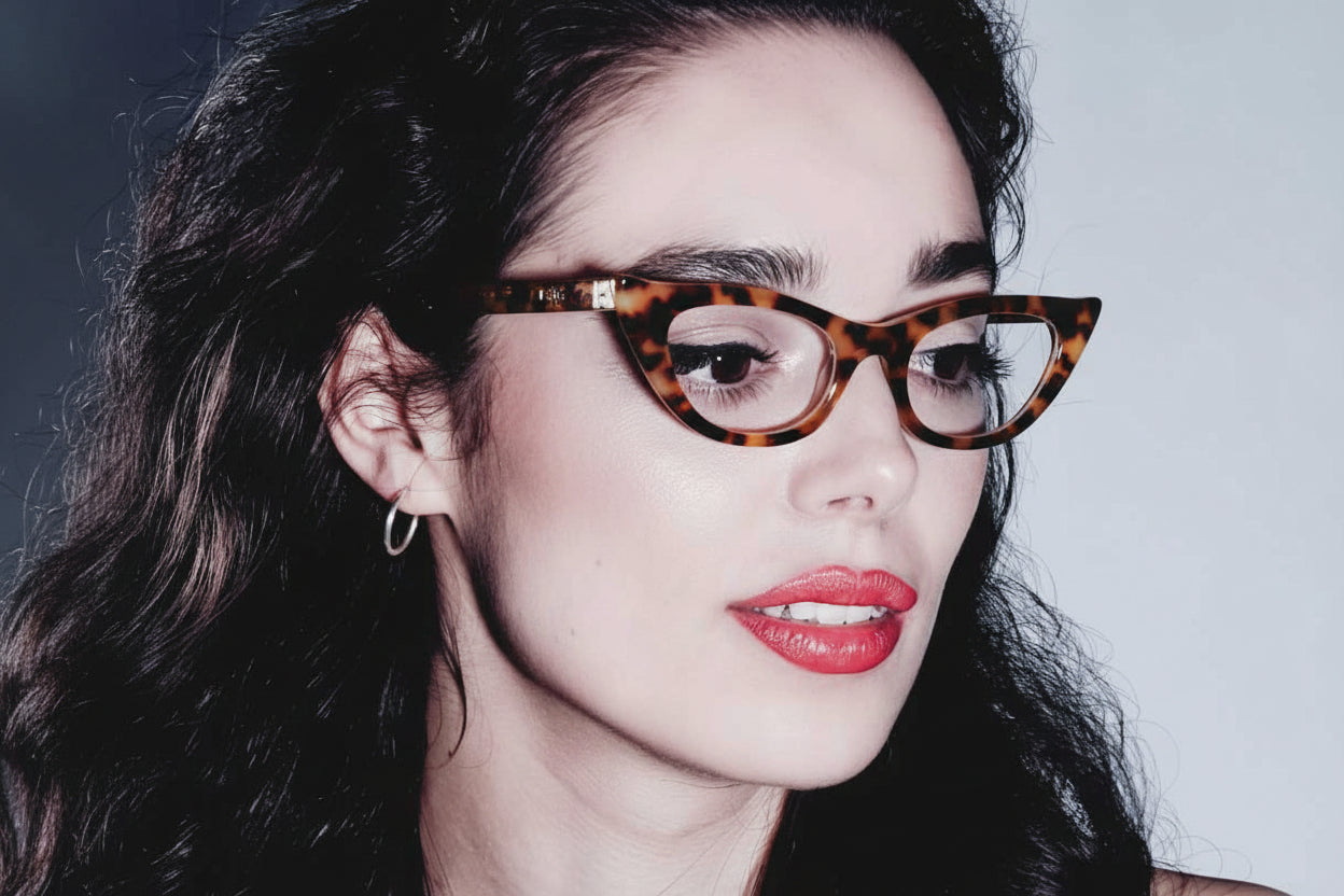 Woman wearing slim tortoiseshell cat eye glasses 