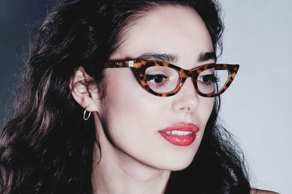 Woman wearing slim tortoiseshell cat eye glasses 