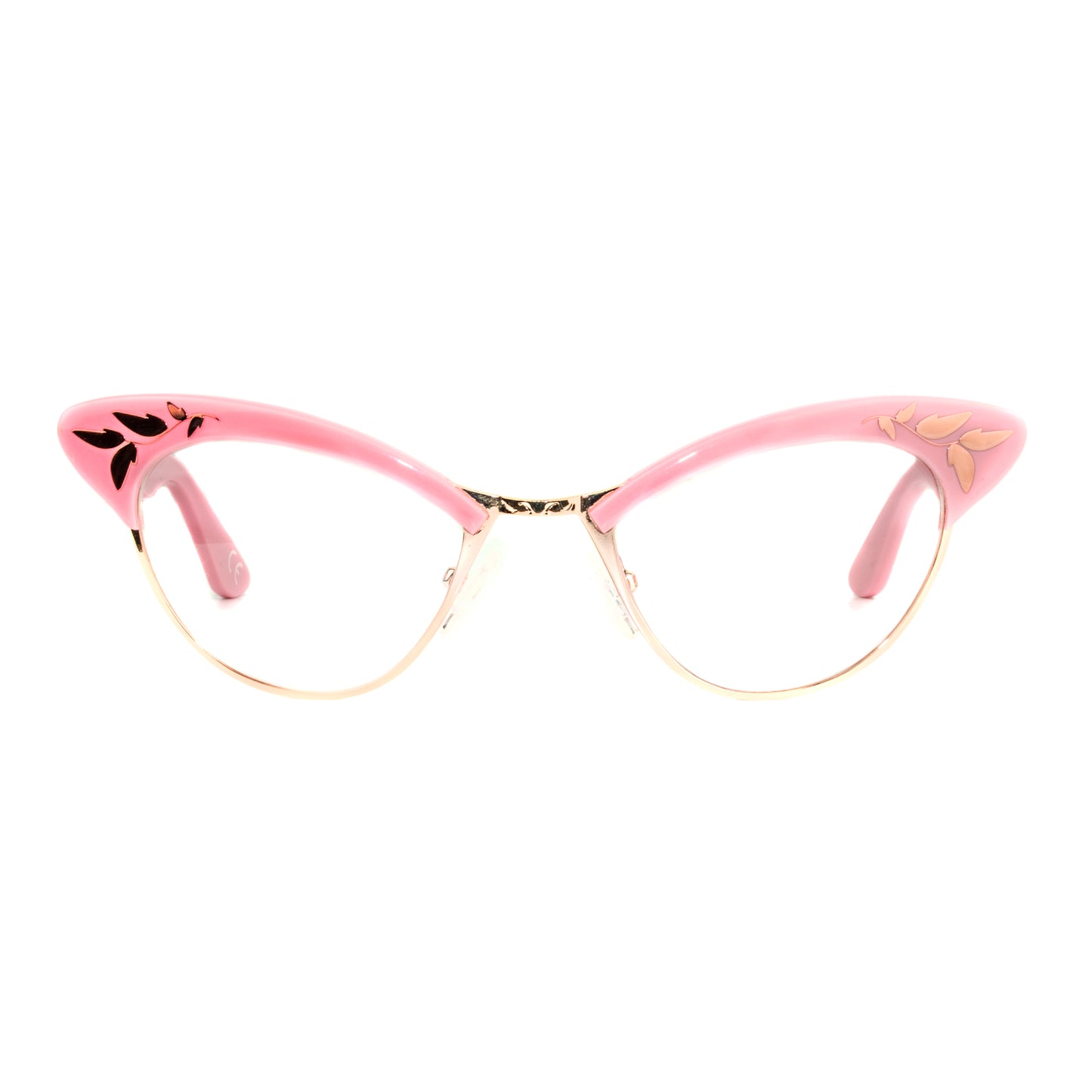 A pair of pink and rose gold cat eye glasses with decorative rose gold leaf patterns on the browline.