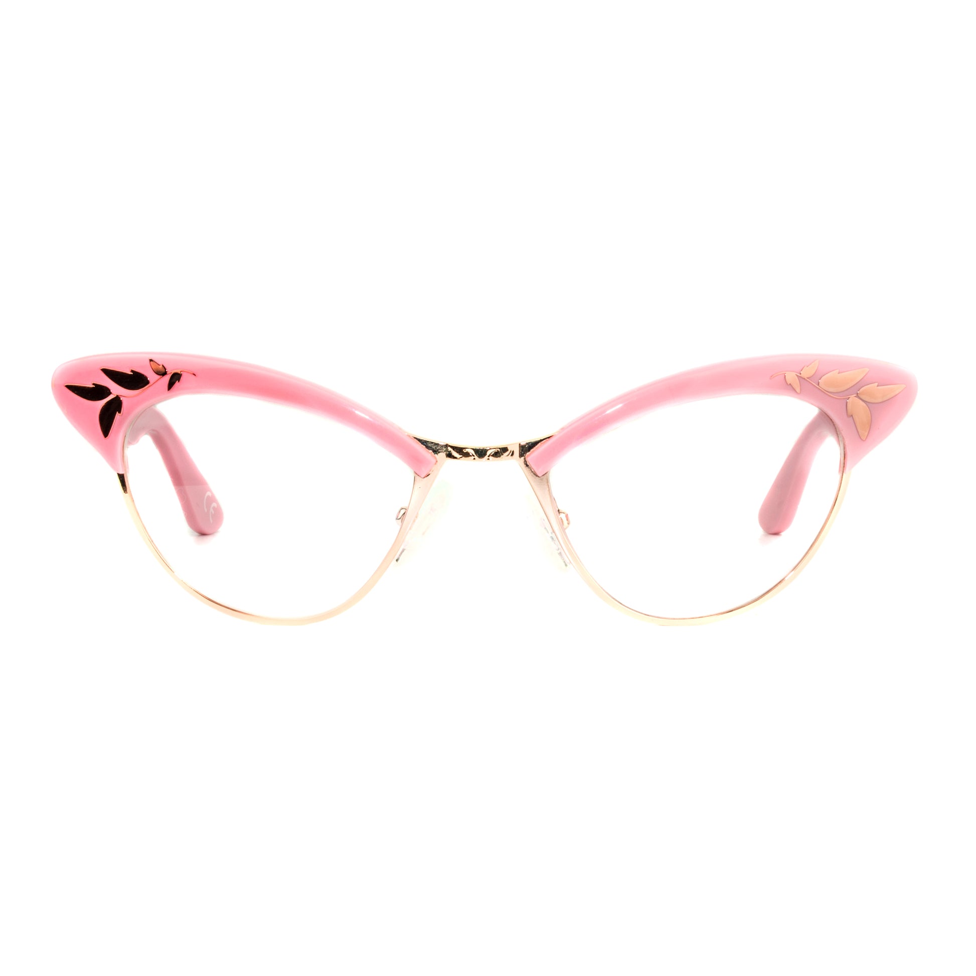 A pair of pink and rose gold cat eye glasses with decorative rose gold leaf patterns on the browline.